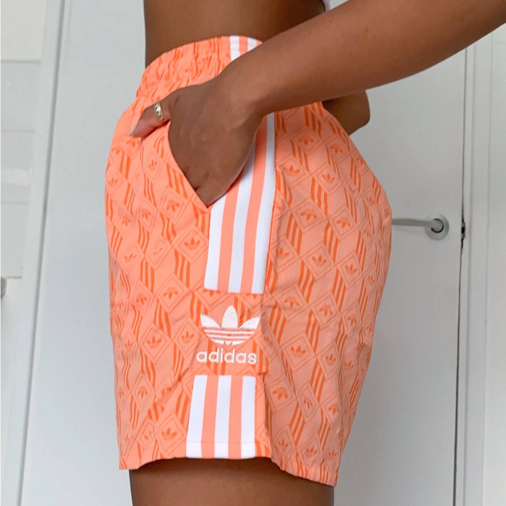 adidas Originals graphic logo shorts in coral